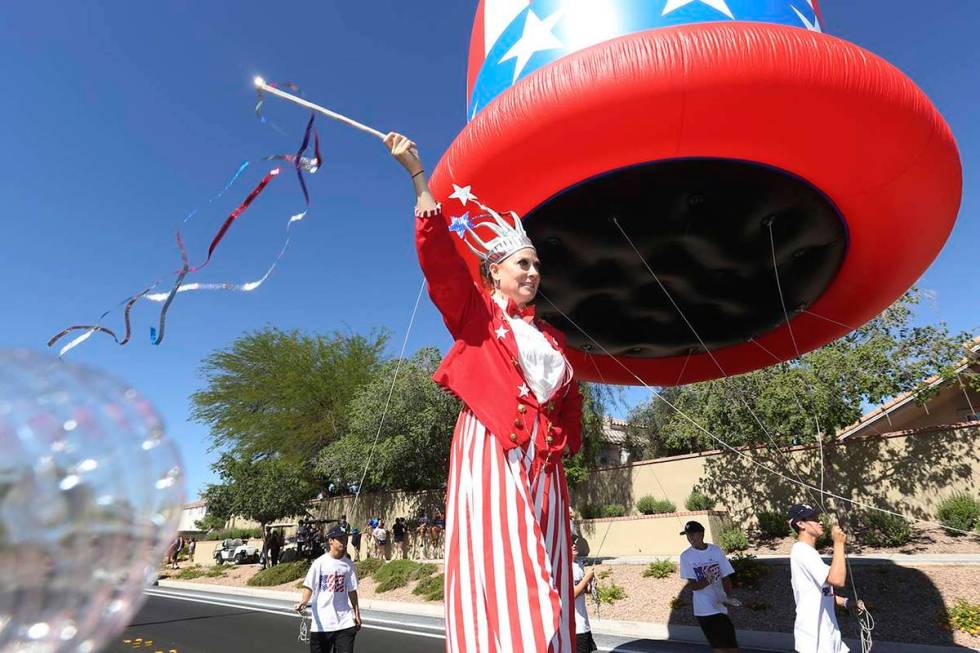 Sara Back waves her baton during the 25th annual Summerlin Council Patriotic Parade on July 4, ...