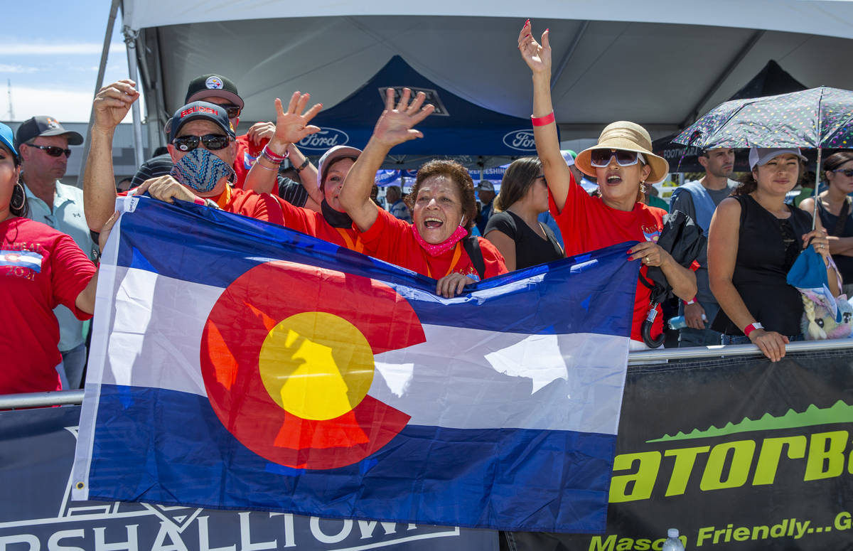 Fans of Juan Cabral of Aurora, CO., cheer him on as competitors work their bricks and mortar in ...