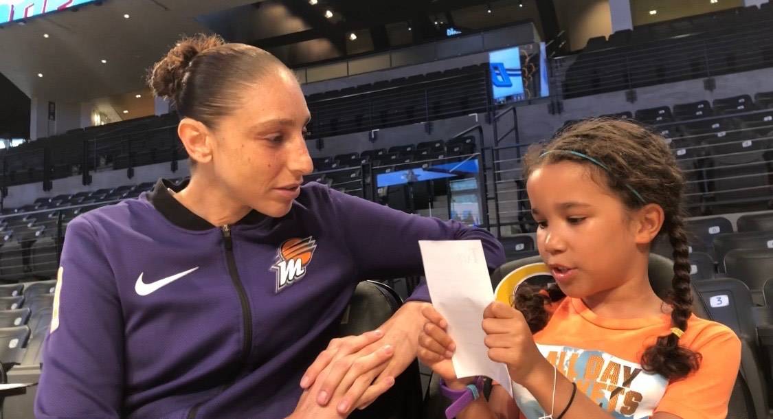 WNBA journalist Pepper Persley, 10, speaks with Phoenix Mercury guard Diana Taurasi, whom many ...