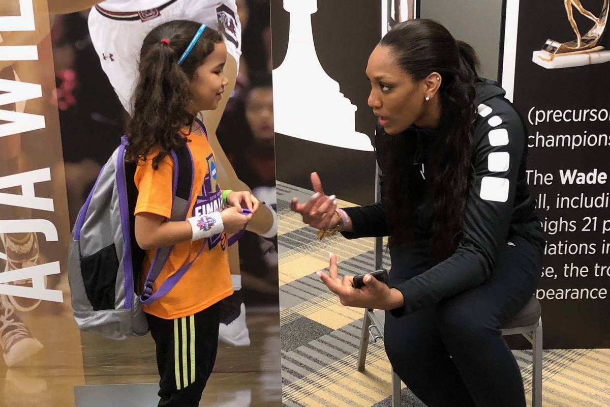 WNBA journalist Pepper Persley, 10, speaks with Aces star forward and reigning WNBA A'ja Wilson ...