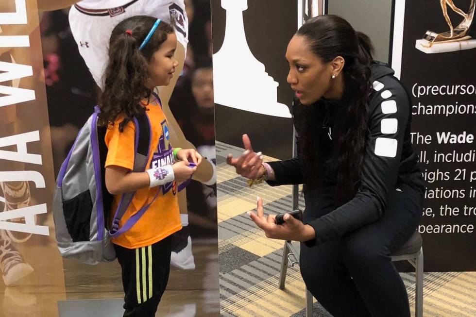WNBA journalist Pepper Persley, 10, speaks with Aces star forward and reigning WNBA A'ja Wilson ...