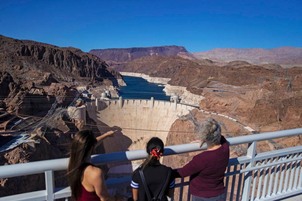 Abigail and Veronica Jones, left, and Pamela Smith look out at Lake Mead and the Hoover Dam whi ...