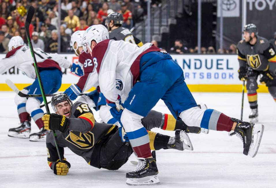 Golden Knights right wing Reilly Smith (19) is taken to the ice after a check by Colorado Avala ...