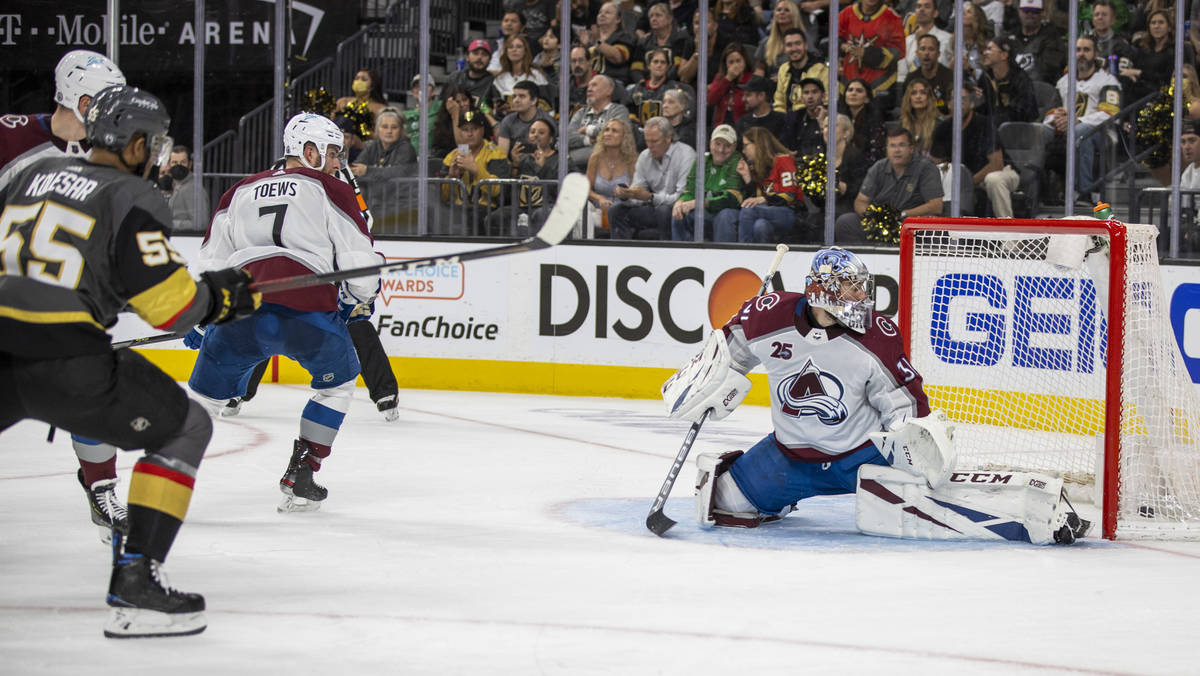 Golden Knights right wing Keegan Kolesar (55) shoots and scores past Colorado Avalanche goalten ...