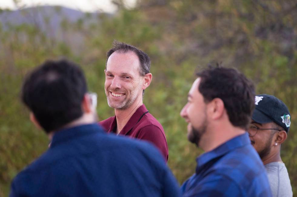 Clark County Commissioner Justin Jones, center, speaks with attendees during an event to discus ...