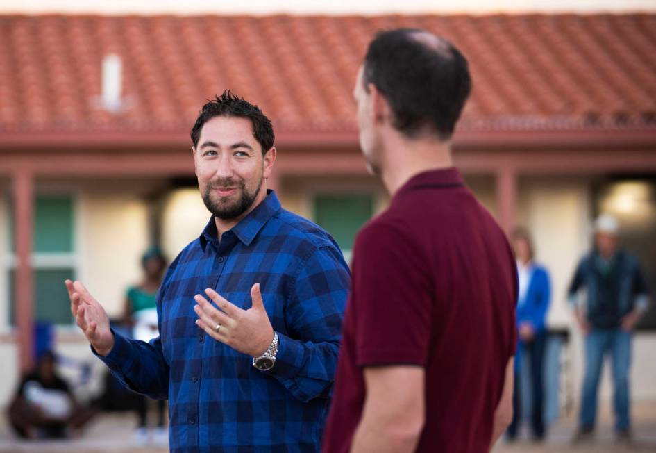 Clark County Commissioners Michael Naft, left, and Justin Jones address attendees during an inf ...