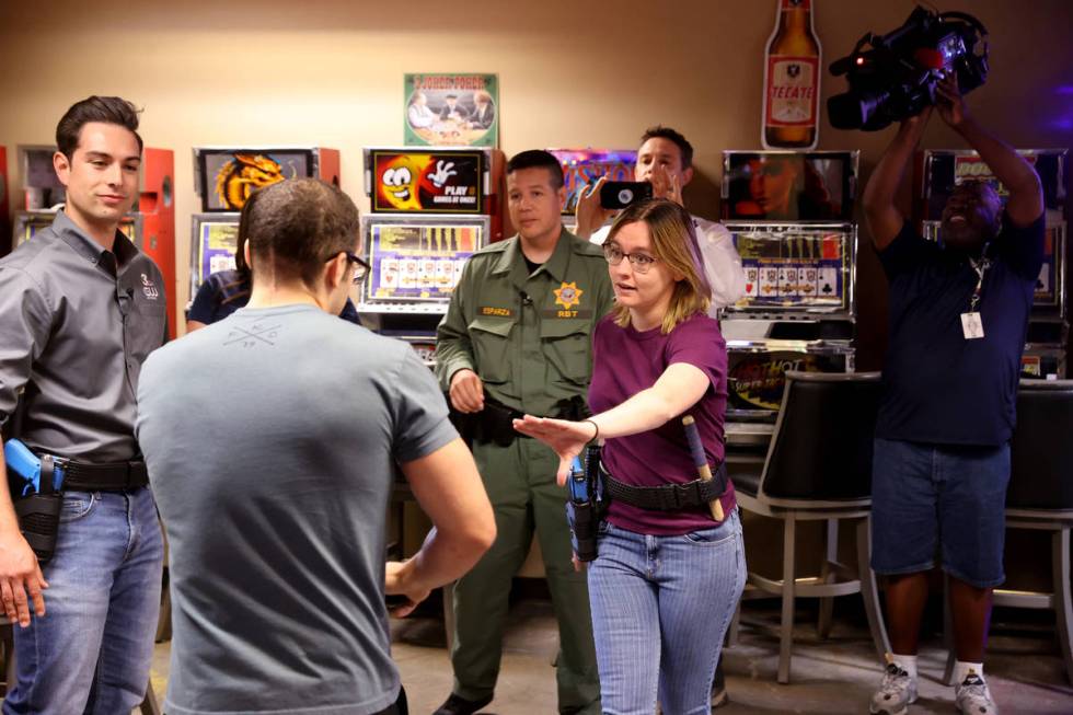 Las Vegas Review-Journal reporter Katelyn Newberg attempts to de-escalate during a scenario at ...