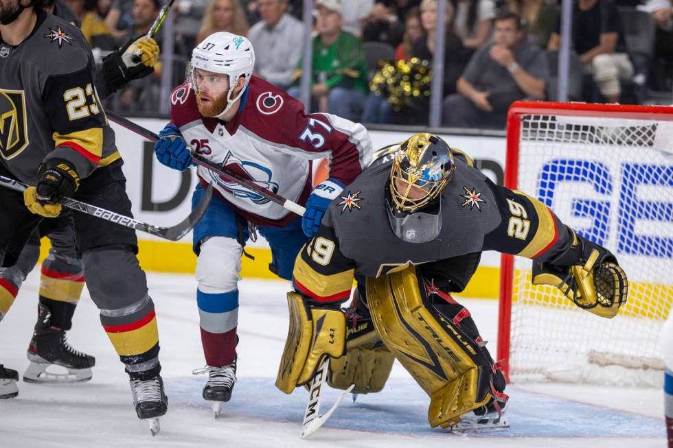 Colorado Avalanche left wing J.T. Compher (37) and Golden Knights goaltender Marc-Andre Fleury ...