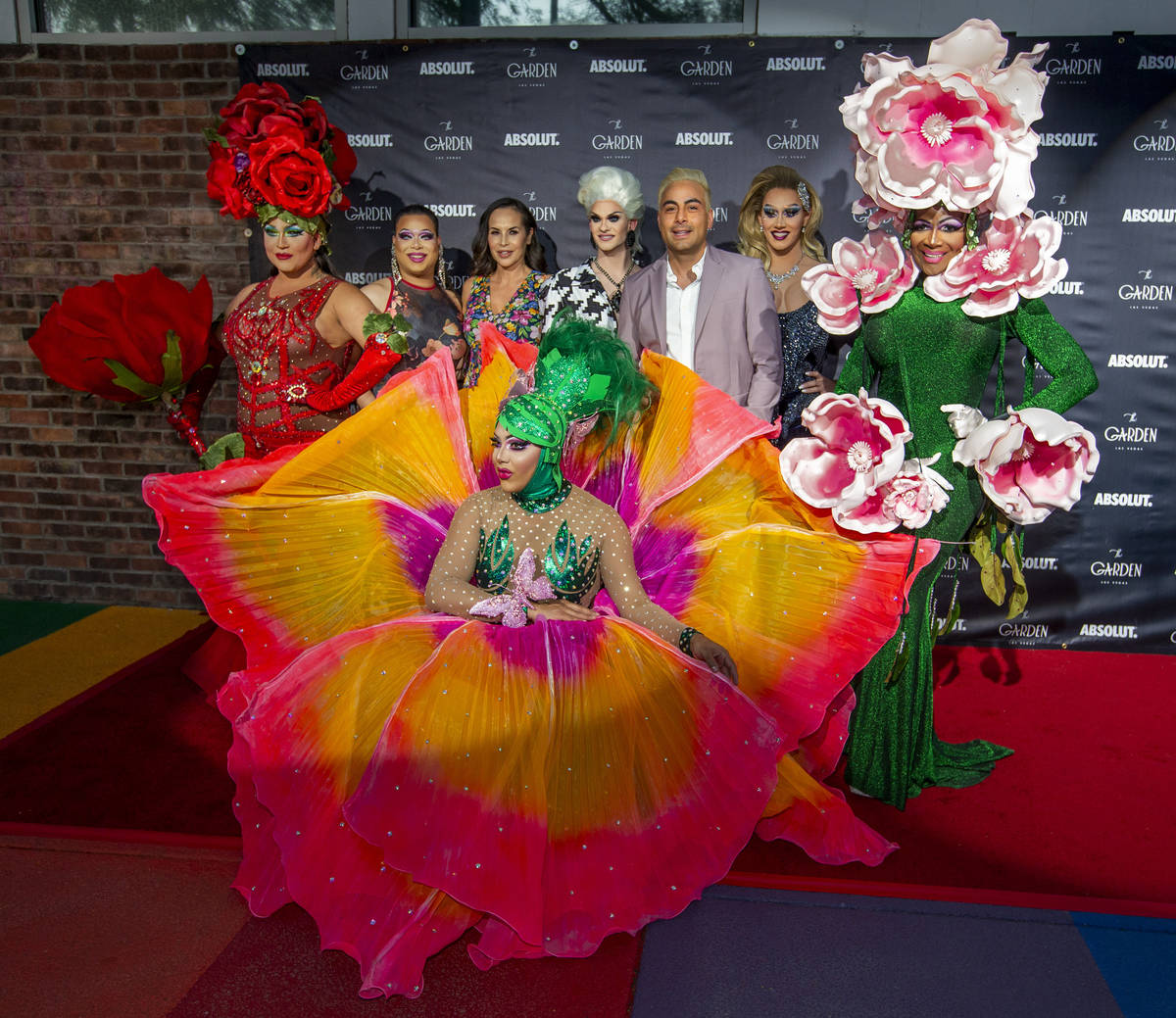 Performers gather about owner Eduardo Cordova, center, on the red carpet as alternative lifesty ...