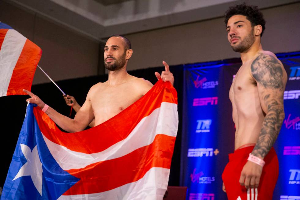 Jose Pedraza, left, and Julian Rodriguez, pose during a weigh-in event at the Virgin Hotels Las ...
