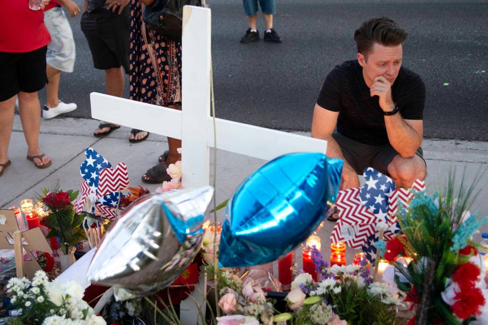 Chris Alderman, Walter Anderson's nephew, mourns at a vigil for his uncle near the intersection ...