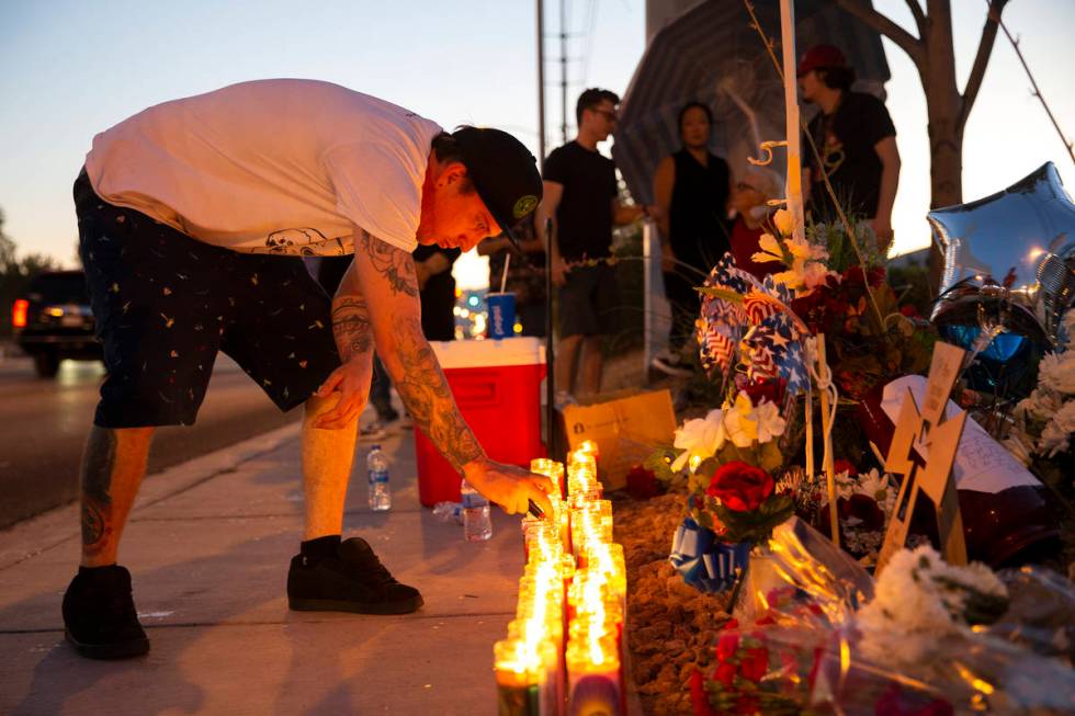 Sheldon Cooper, a close friend of Walter Anderson's son Ryan, keeps the candles lit at a vigil ...