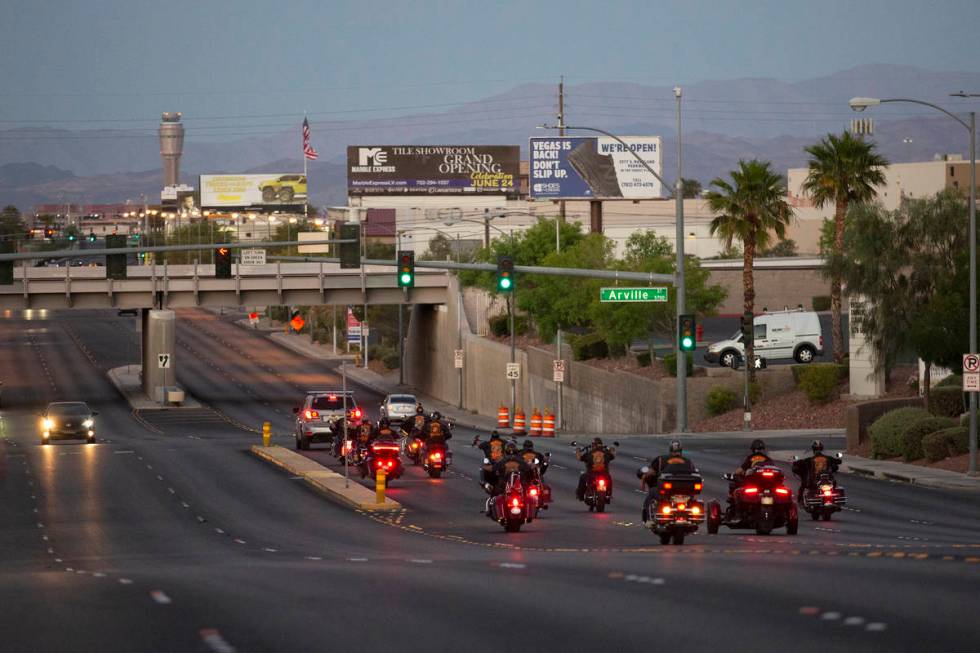 The Marine Riders Motorcycle Club drives away after attending a vigil for Walter Anderson near ...