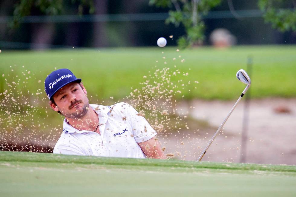 Doc Redman hits out of the bunker on the second green during the final round of the Palmetto Ch ...