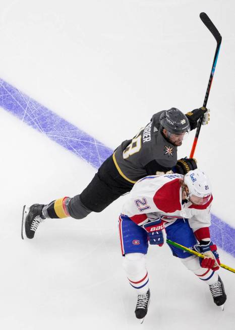 Golden Knights left wing William Carrier (28) skates around Canadiens center Eric Staal (21) du ...