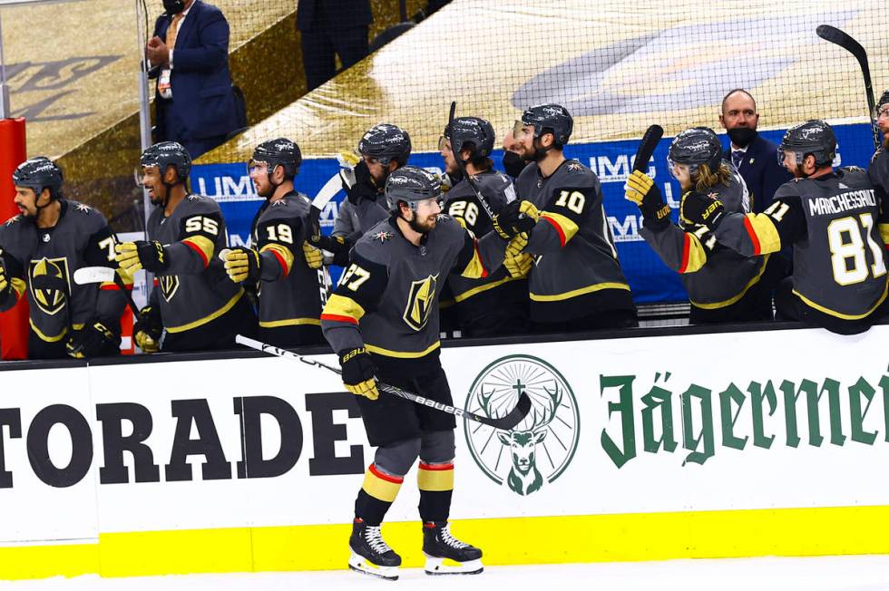 Golden Knights’ Shea Theodore (27) celebrates after scoring against the Montreal Canadie ...