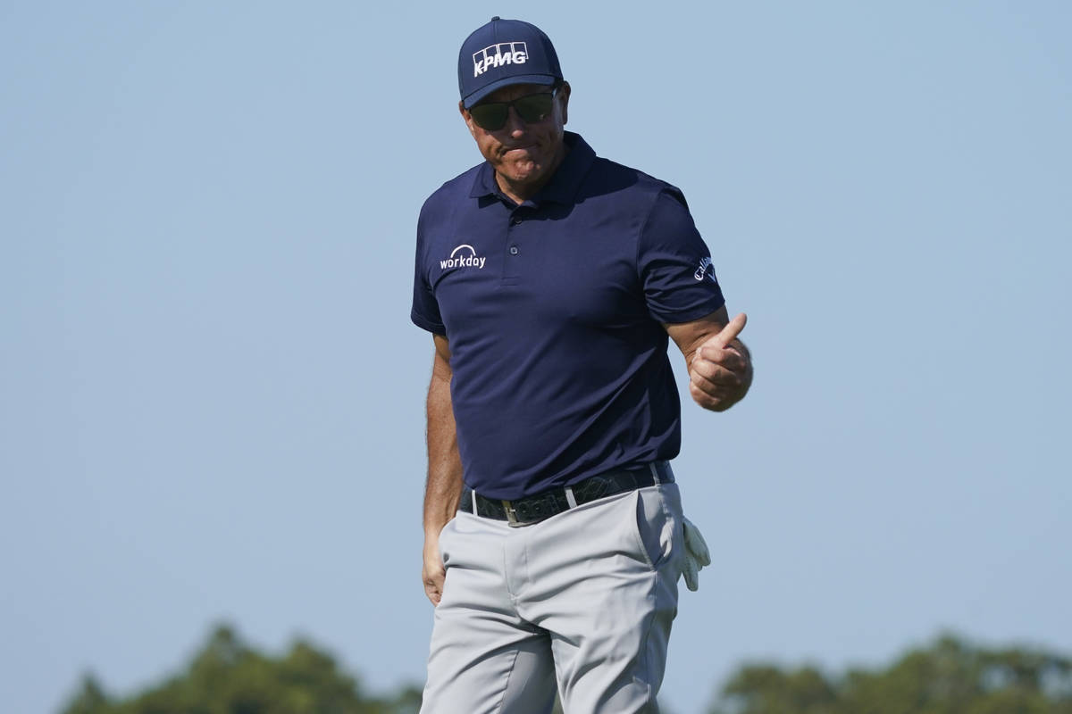 Phil Mickelson leaves the 11th green during the final round at the PGA Championship golf tourna ...