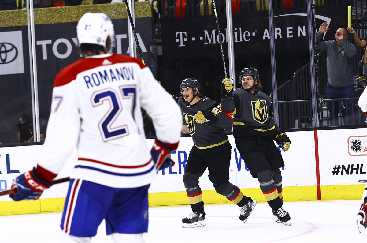 Golden Knights’ Mattias Janmark, right, celebrates his goal alongside defenseman Nick Ho ...