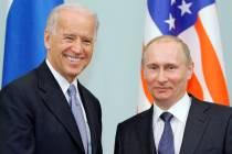 FILE - In this March 10, 2011 file photo, then Vice President Joe Biden, left, shakes hands wi ...