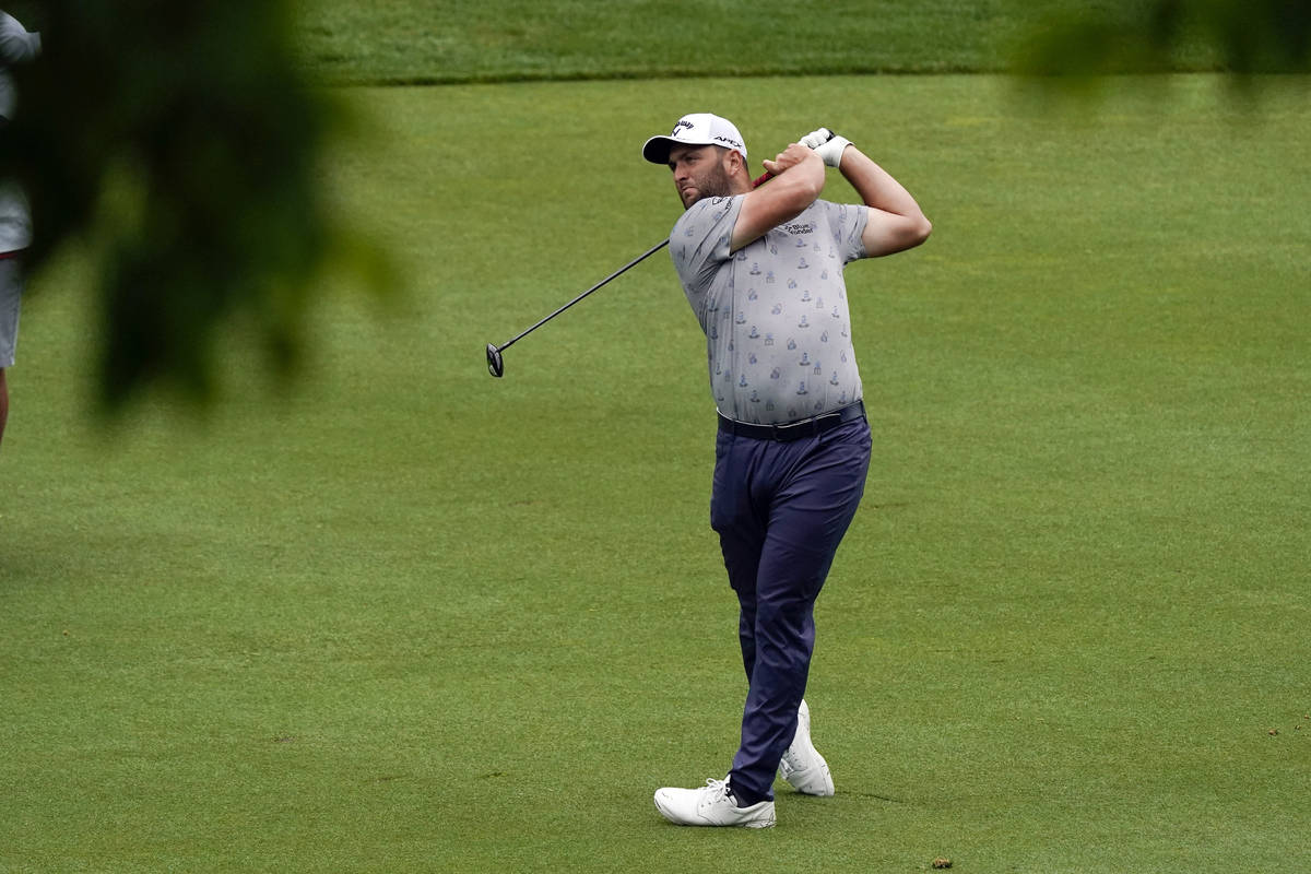Jon Rahm hits from the 11th fairway during the first round of the Memorial golf tournament, Thu ...
