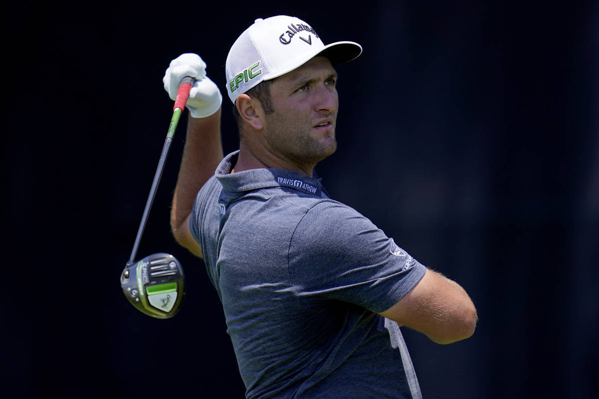 Jon Rahm, of Spain, hits from the seventh tee during a practice round of the U.S. Open Golf Cha ...