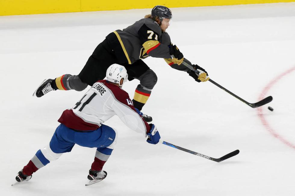 Vegas Golden Knights center William Karlsson (71) takes a shot under pressure from Colorado Ava ...