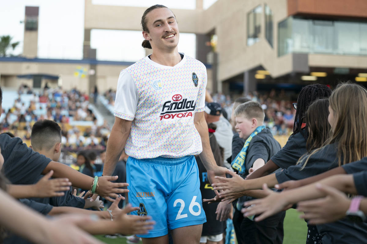 Cal Jennings greets fans during player introductions at the Lights season home opener. (Las Veg ...
