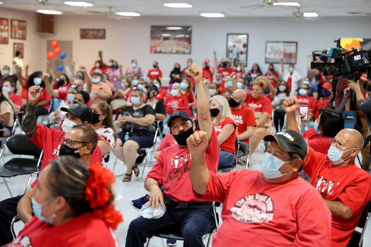 Culinary Workers Union Local 226 members cheer at their union hall in downtown Las Vegas Tuesda ...