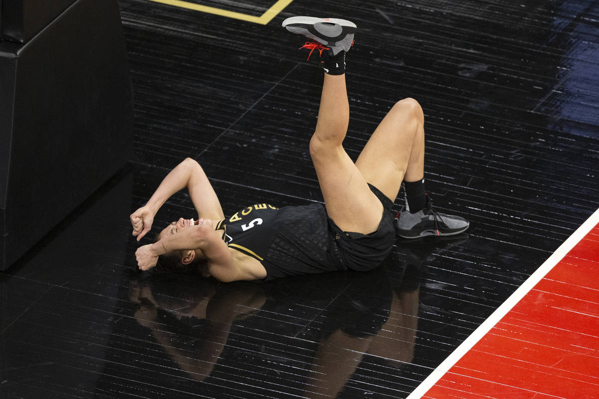 Las Vegas Aces forward Dearica Hamby (5) is in pain after taking a fall during a WNBA game agai ...