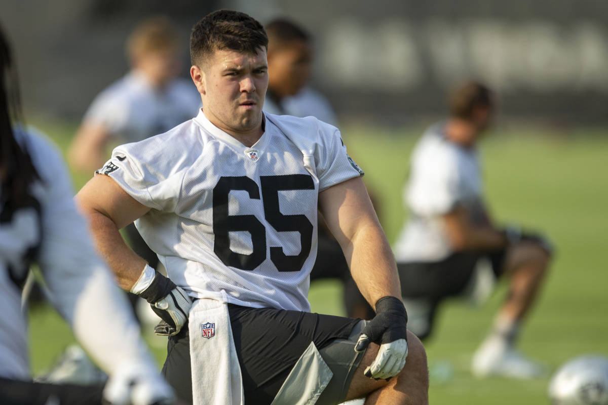 Raiders center Jimmy Morrissey (65) stretches during an NFL football practice on Wednesday, Jun ...