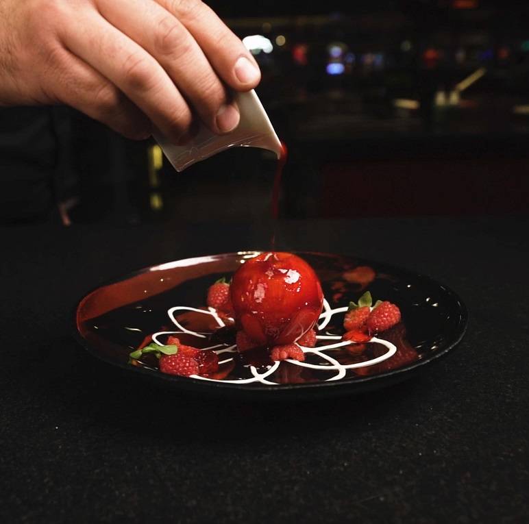 White chocolate sphere with fresh raspberry and yuzu ice cream at L'Atelier Joel Robuchon. (MGM ...