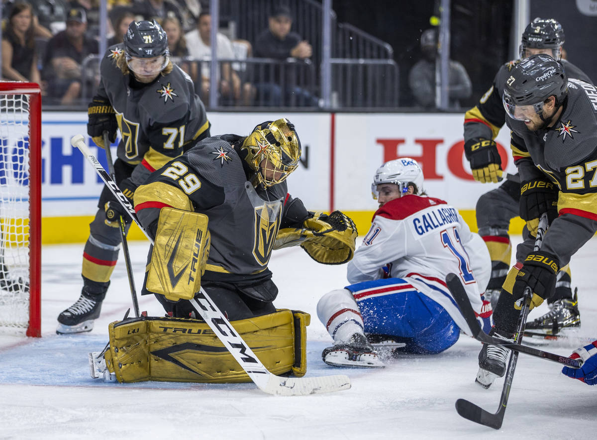 Golden Knights goaltender Marc-Andre Fleury (29) defends the net from Montreal Canadiens right ...