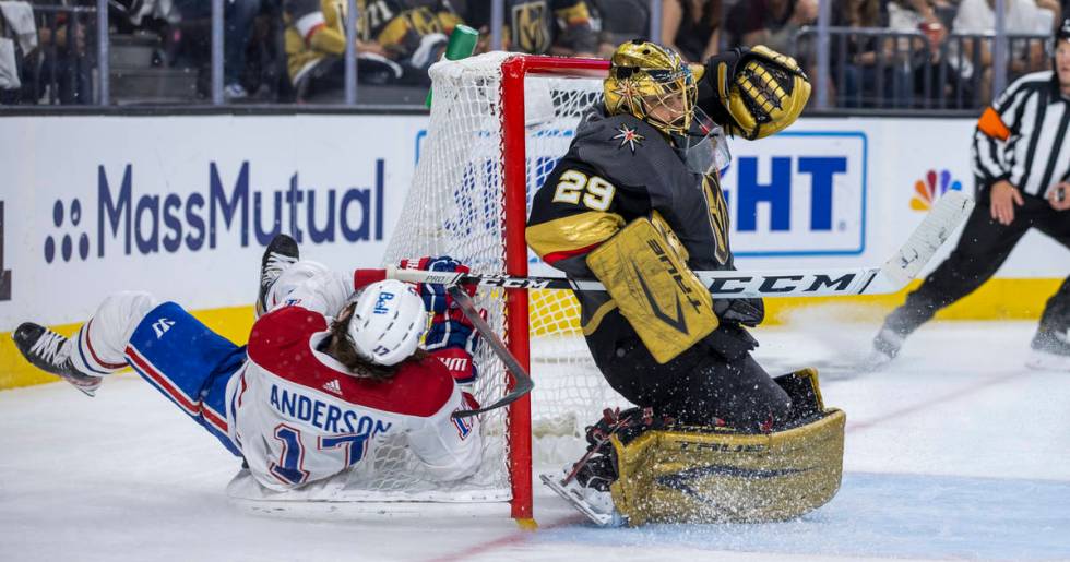 Golden Knights goaltender Marc-Andre Fleury (29) defends the net from Montreal Canadiens right ...