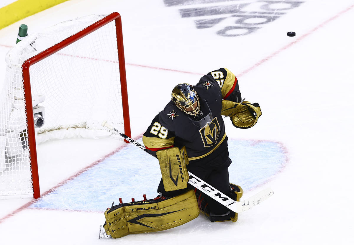 Golden Knights goaltender Marc-Andre Fleury blocks shot off his left shoulder during the second ...