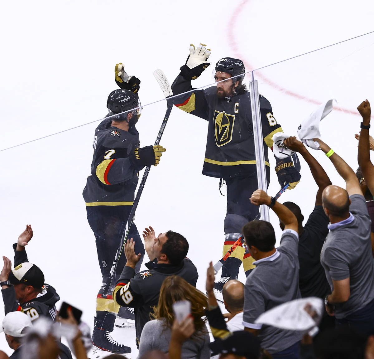 Golden Knights defenseman Alex Pietrangelo, left, celebrates his goal with Mark Stone (61) duri ...