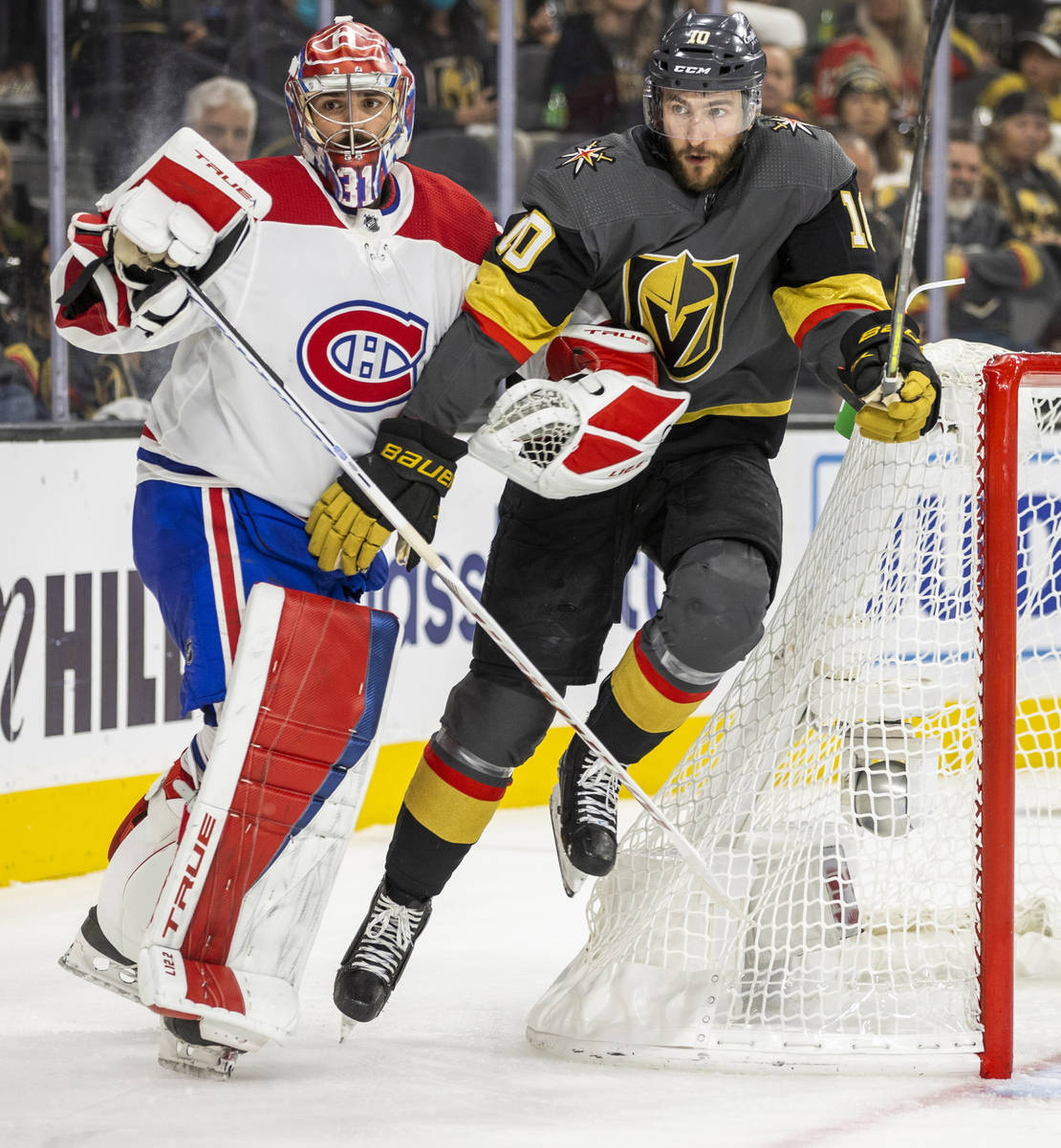 Golden Knights center Nicolas Roy (10) fights for position with Montreal Canadiens goaltender C ...