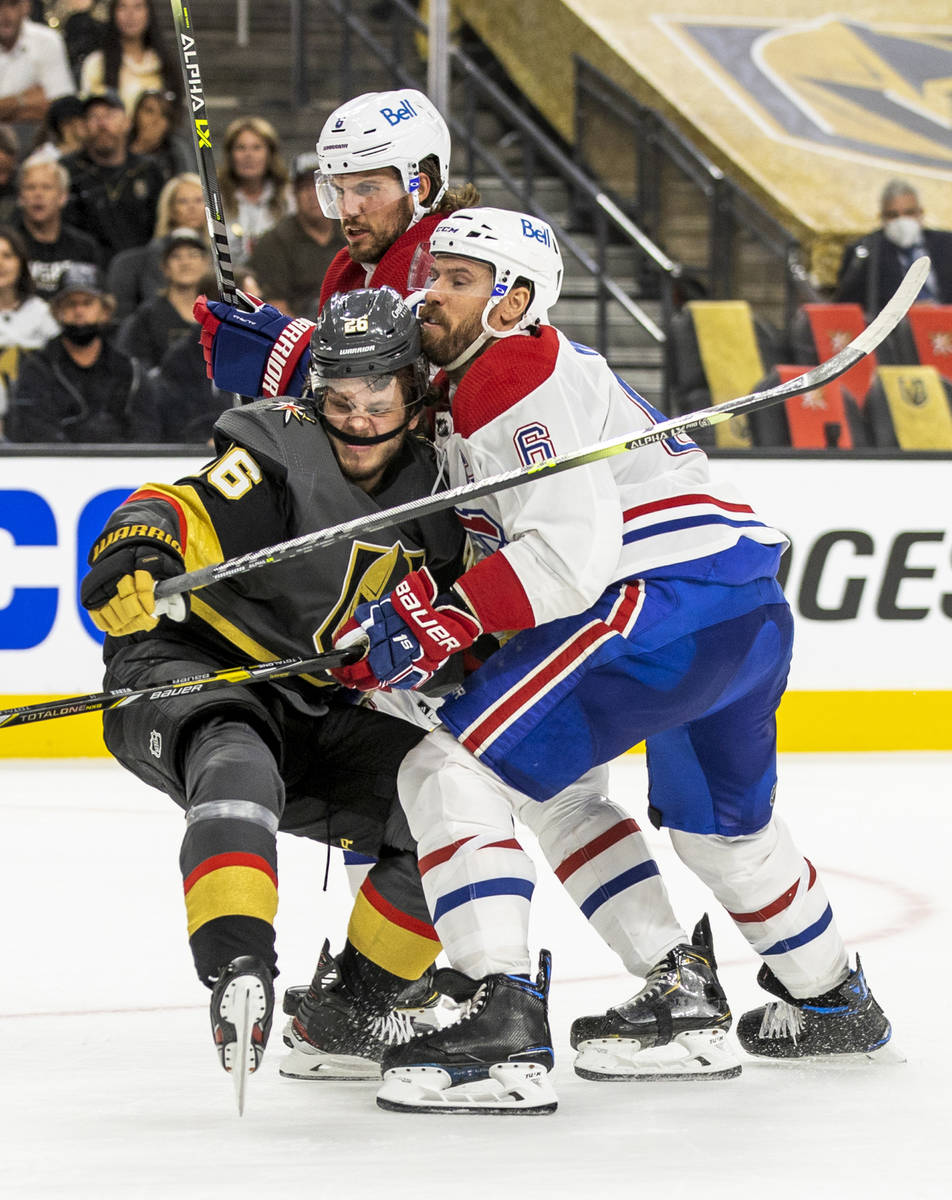 Golden Knights center Mattias Janmark (26) collides with Montreal Canadiens defenseman Shea Web ...