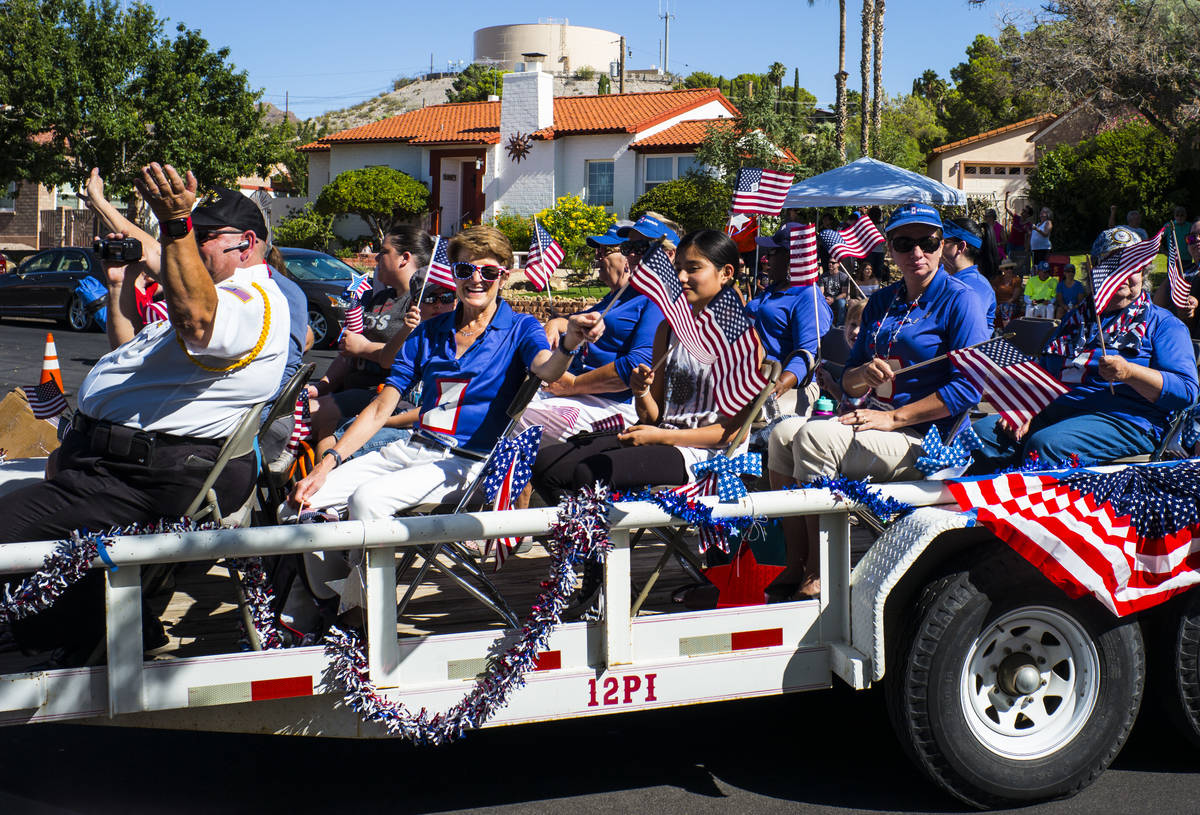 Blue Star Mothers of Nevada wave flags while participating in the parade at the annual Damboree ...