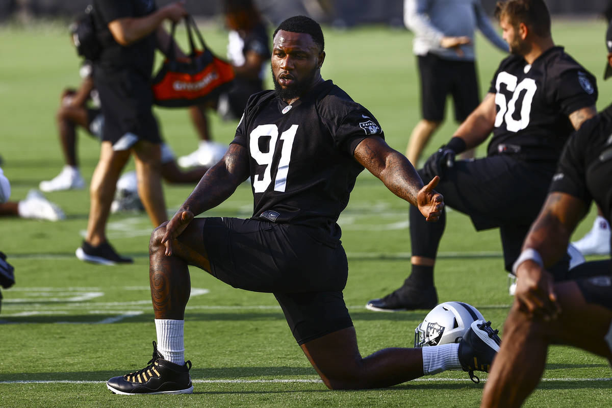 Raiders defensive end Yannick Ngakoue (91) stretches during an NFL football minicamp at Raiders ...