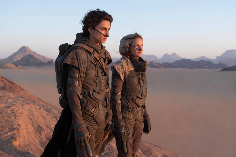 TIMOTHÉE CHALAMET as Paul Atreides and REBECCA FERGUSON as Lady Jessica Atreides in "Dune." (C ...
