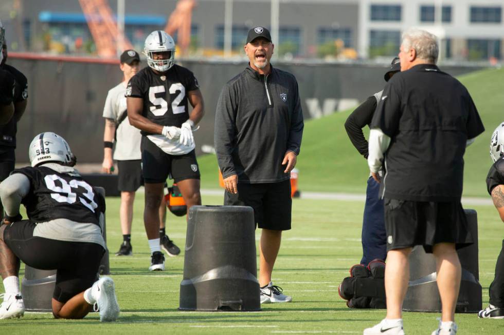 Raiders defensive coordinator Gus Bradley shouts instructions during an NFL football practice o ...