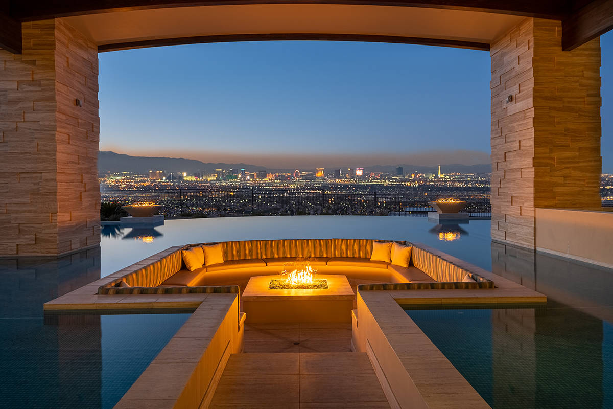 This seating area and fire pit are in the pool and offer sweeping views of the Strip. (Sun West ...