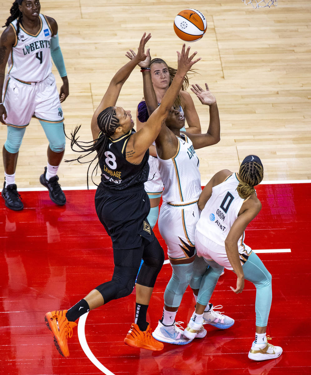 Las Vegas Aces center Liz Cambage (8) gets off a second shot for a score over New York Liberty ...