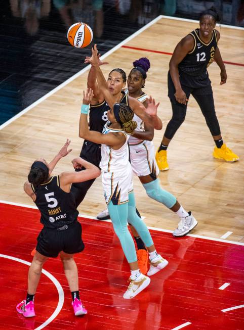 Las Vegas Aces center Liz Cambage (8) blocks a shot by New York Liberty forward Leaonna Odom (0 ...