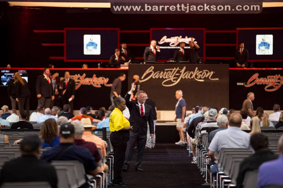A bidding assistant takes a bid for a motorcycle in the Barrett-Jackson auction at the Las Vega ...