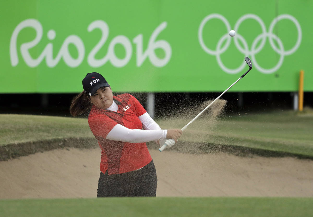Inbee Park of South Korea, hits from the bunker on the 18th hole during the final round of the ...
