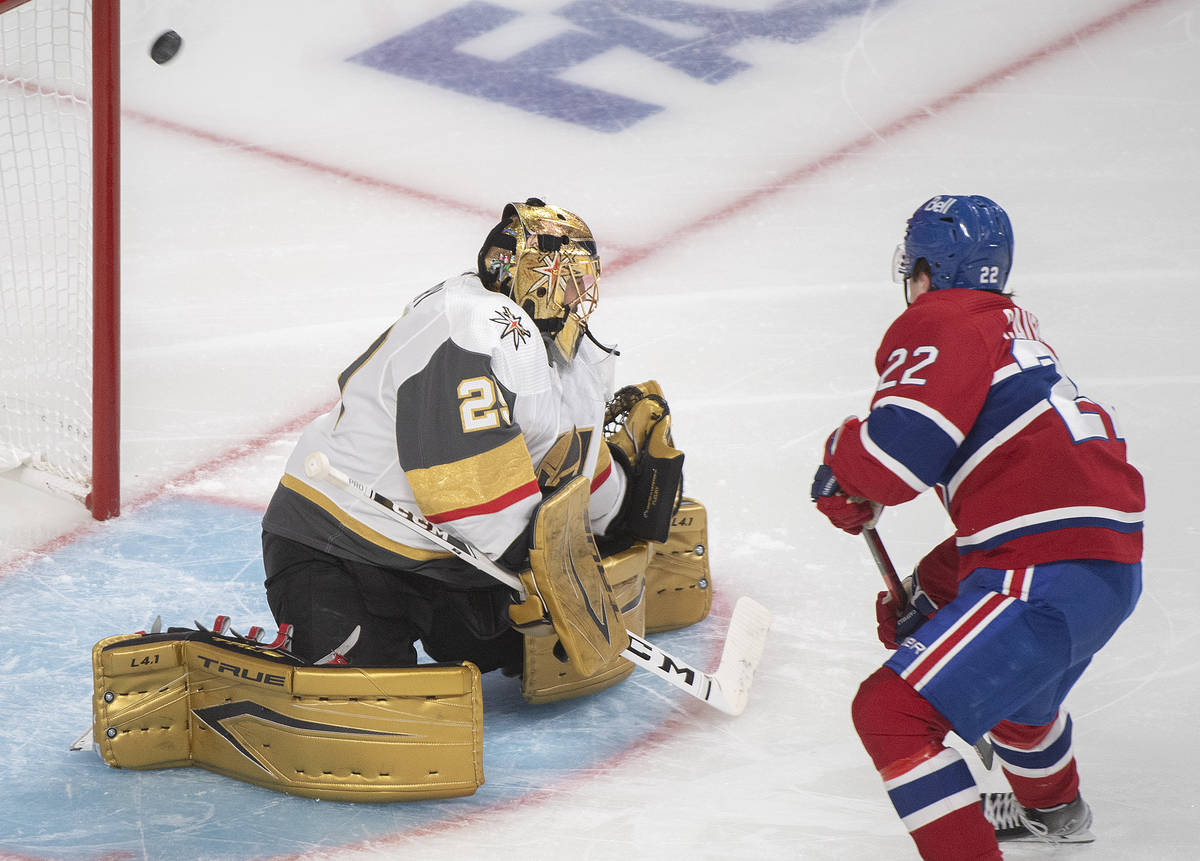 Montreal Canadiens' Cole Caufield scores against Vegas Golden Knights goaltender Marc-Andre Fle ...
