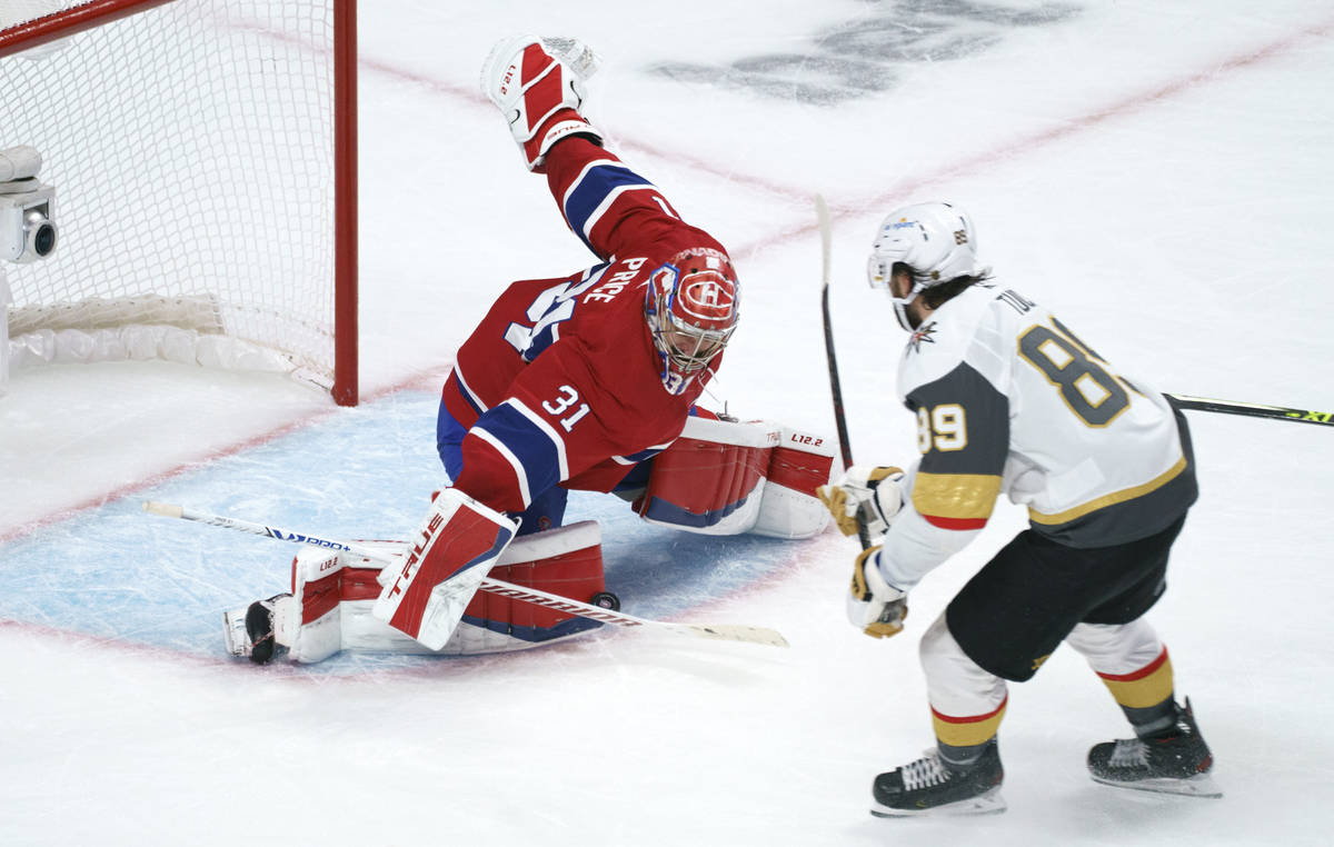 Montreal Canadiens goaltender Carey Price makes a save on Vegas Golden Knights' Alex Tuch durin ...