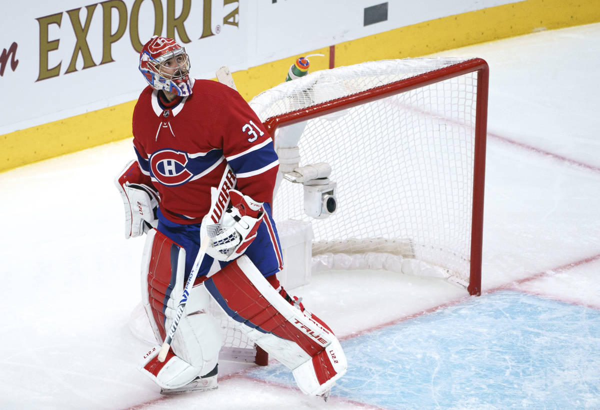 Montreal Canadiens goaltender Carey Price looks up at the replay following a goal by Vegas Gold ...