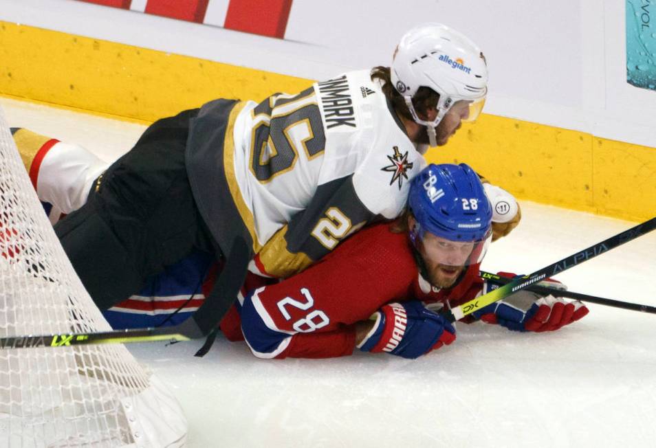 Vegas Golden Knights' Mattias Janmark falls onto Montreal Canadiens' Jon Merrill during the fir ...